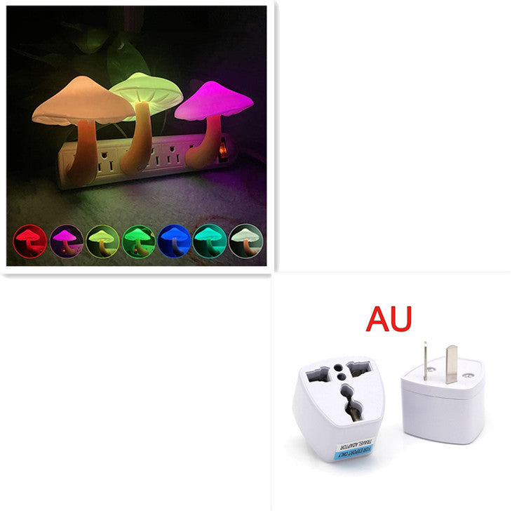 Colorful mushroom-shaped night light with a plug adapter on a white background.